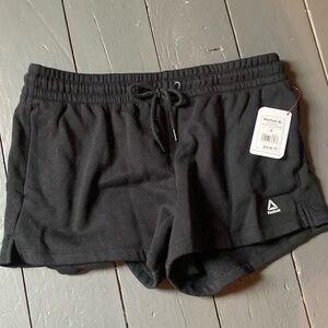 Black Reebok sweatpants shorts